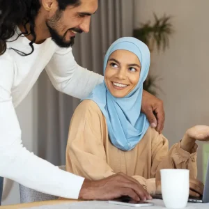side-view-smiley-islamic-couple-with-laptop-ezgif.com-resize